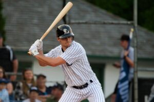 Baseball player holding a bat ready to swing.