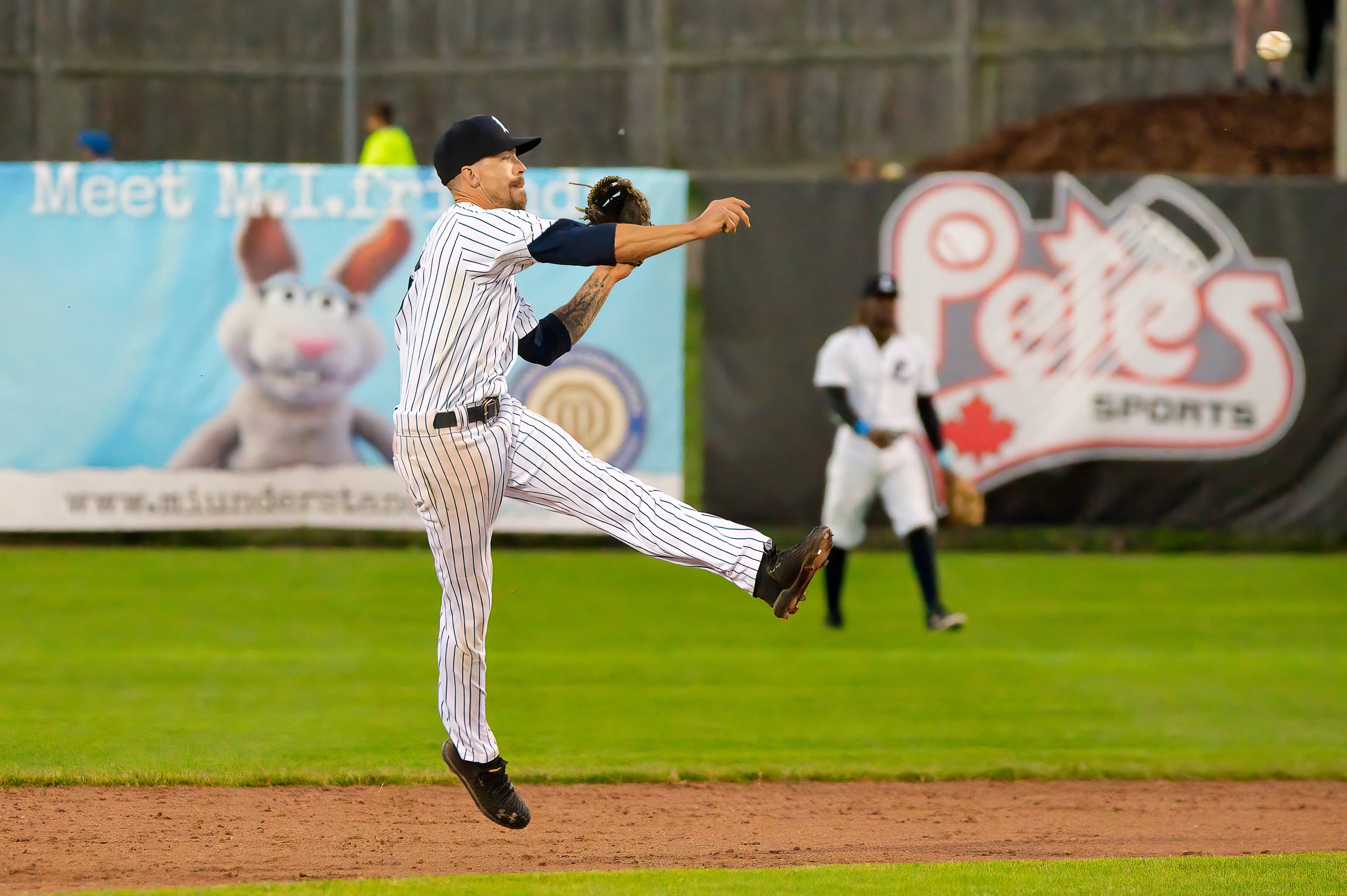 Baseball player throwing a ball.