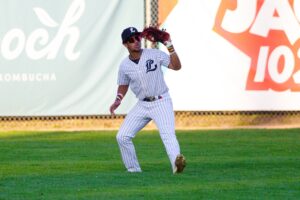 Baseball player ready to catch the ball.