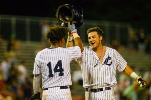 Baseball players congratulating each other.