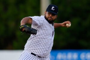 A baseball pitcher throwing a ball.