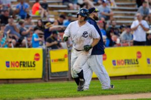 A baseball player running the bases.