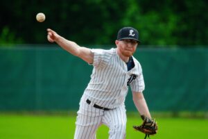 Baseball pitcher throwing a ball.