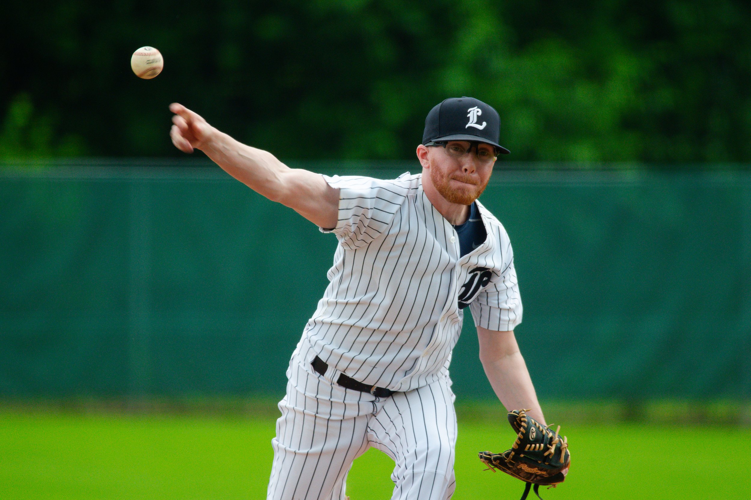 Baseball pitcher throwing a ball.