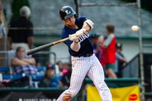 Baseball player swinging a bat.