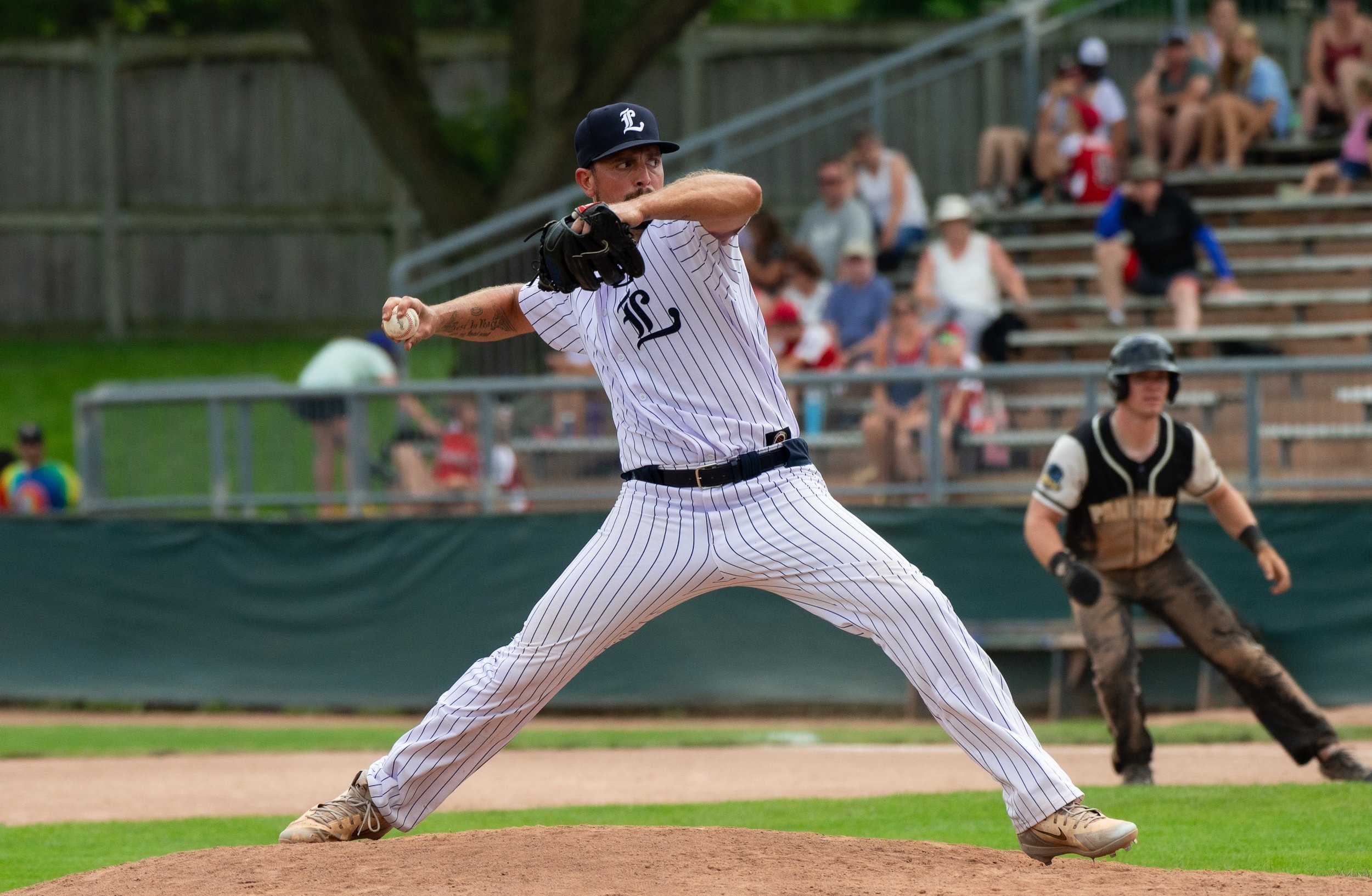 A baseball pitcher throwing a ball.