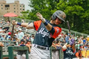 A baseball player swinging the bat. Photo: Isaiah Bergsma