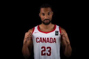Basketball player wearing a jersey that says Canada 23 on it