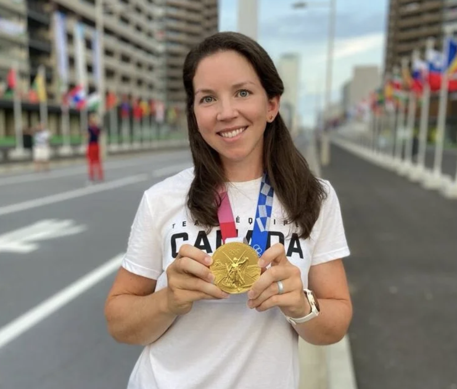 Woman holding a gold medal