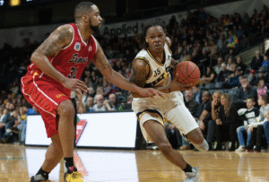 Two men playing basketball