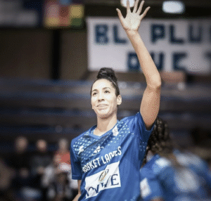 A woman raising her left hand.