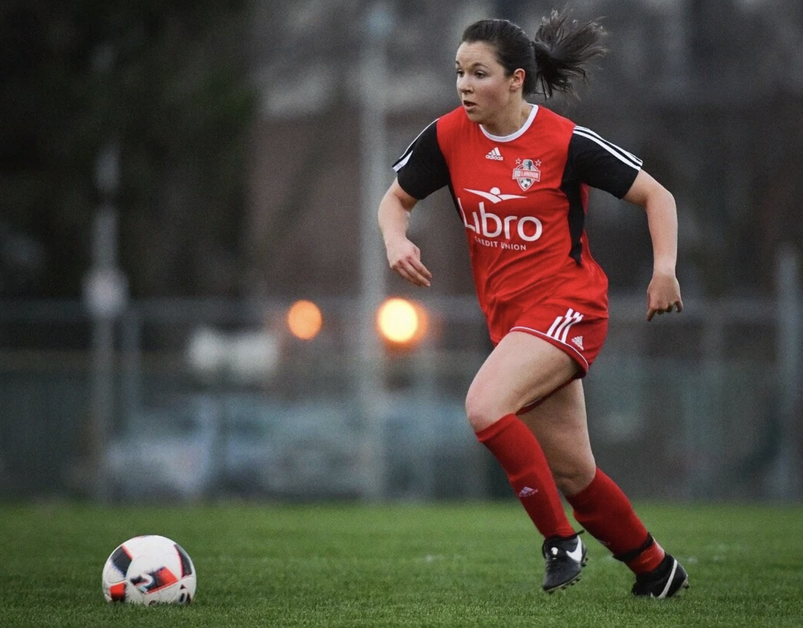 Woman playing soccer.