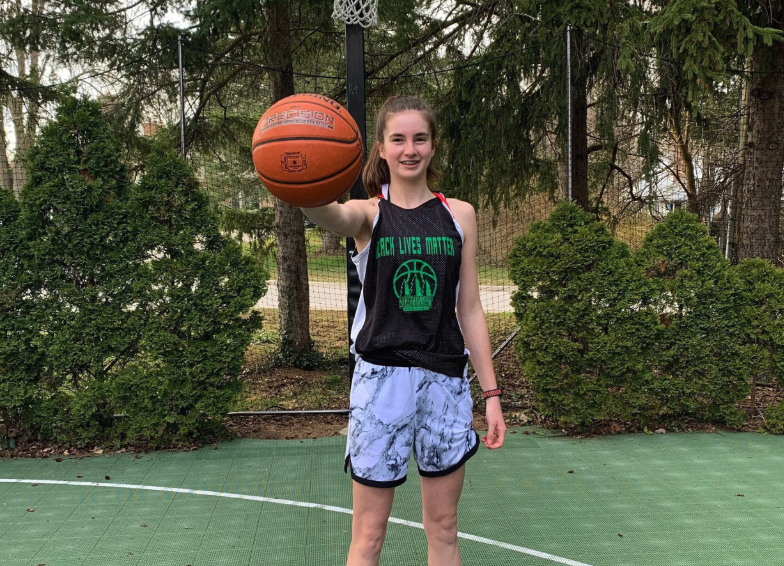 A woman holding a basketball